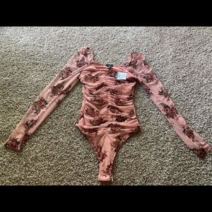 Pink bodysuit with flowers